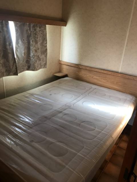 La chambre des parents du mobil-home d’occasion Sir